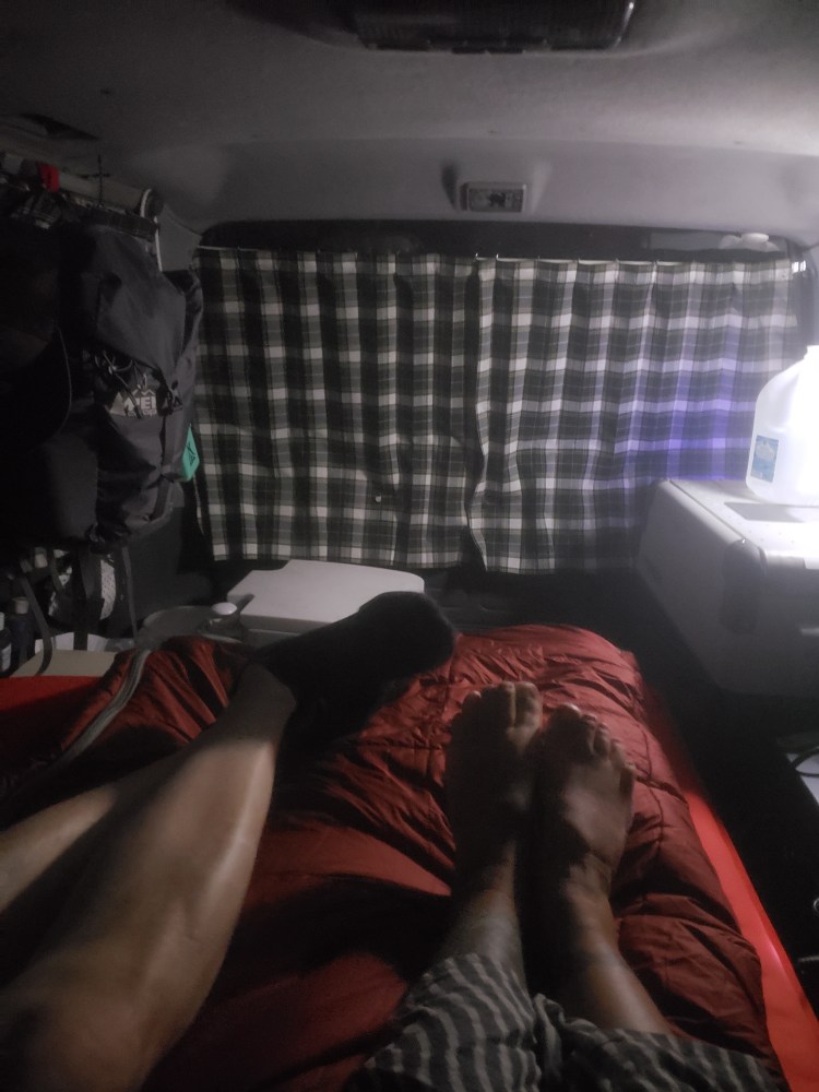 Legs and feet in the van at night