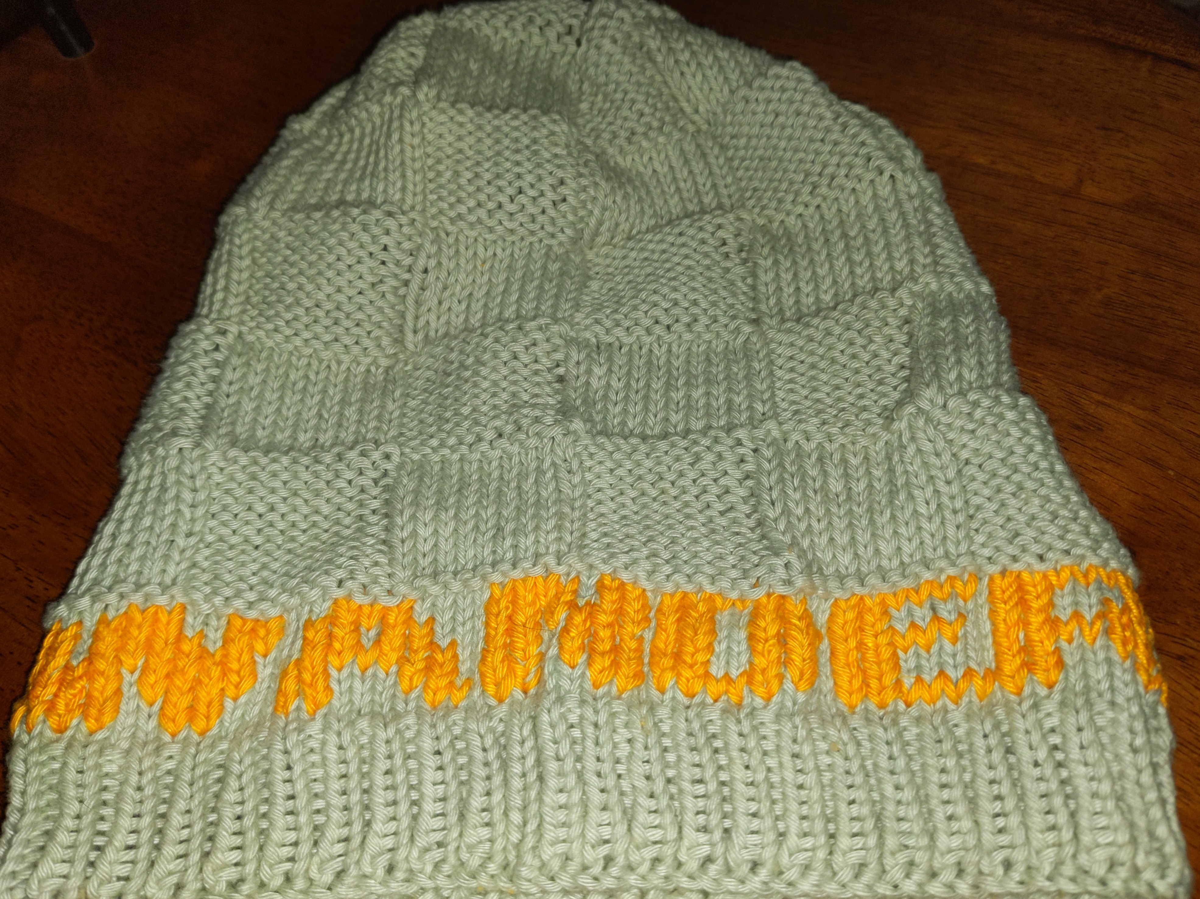 knitted hat with the word "Wander"
