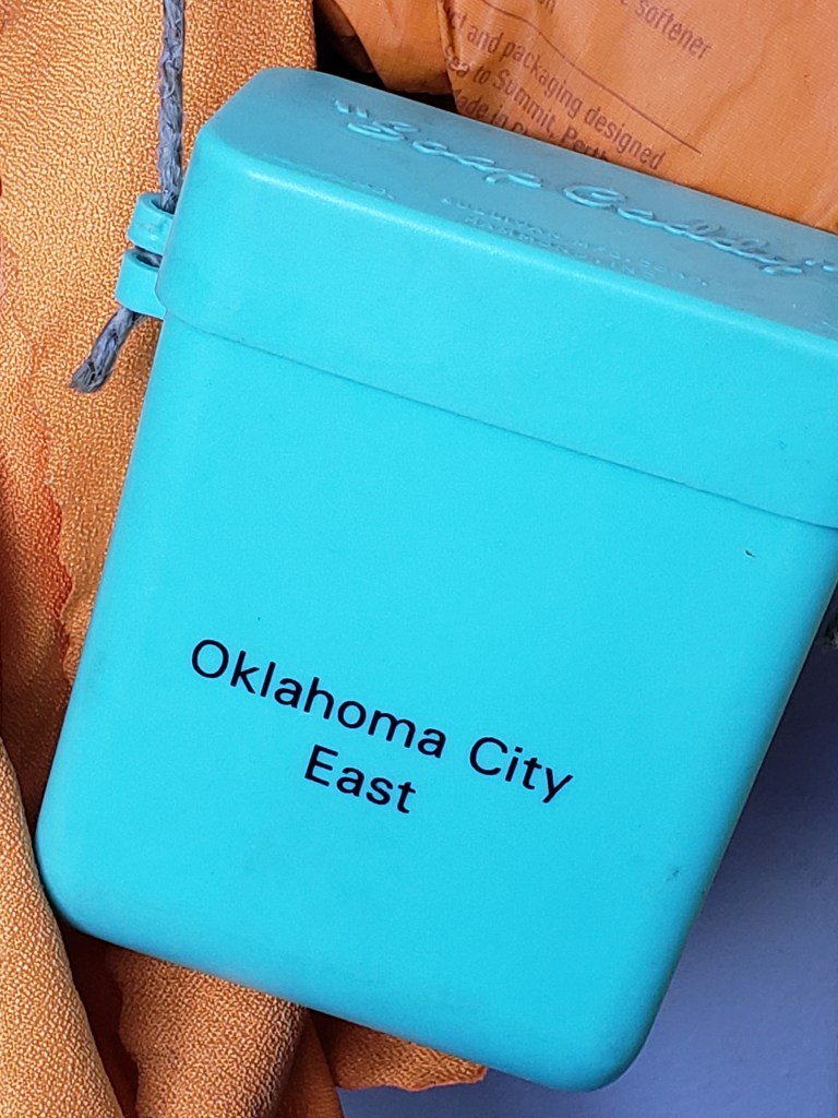 blue soap caddy with "Oklahoma City East" printed on it