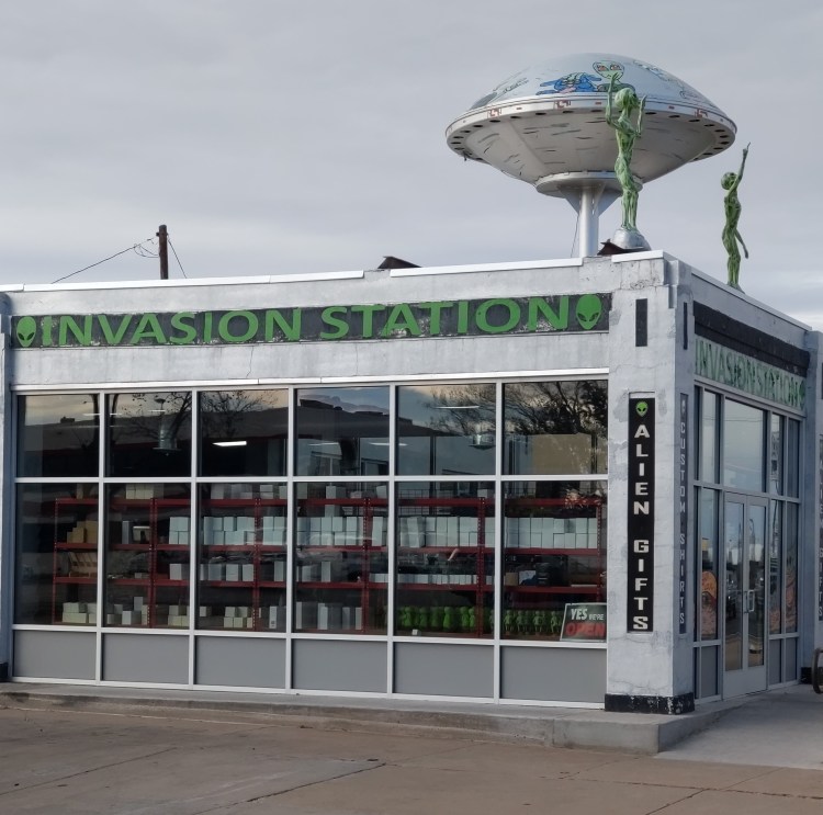 souvenir shop with UFO and aliens on roof