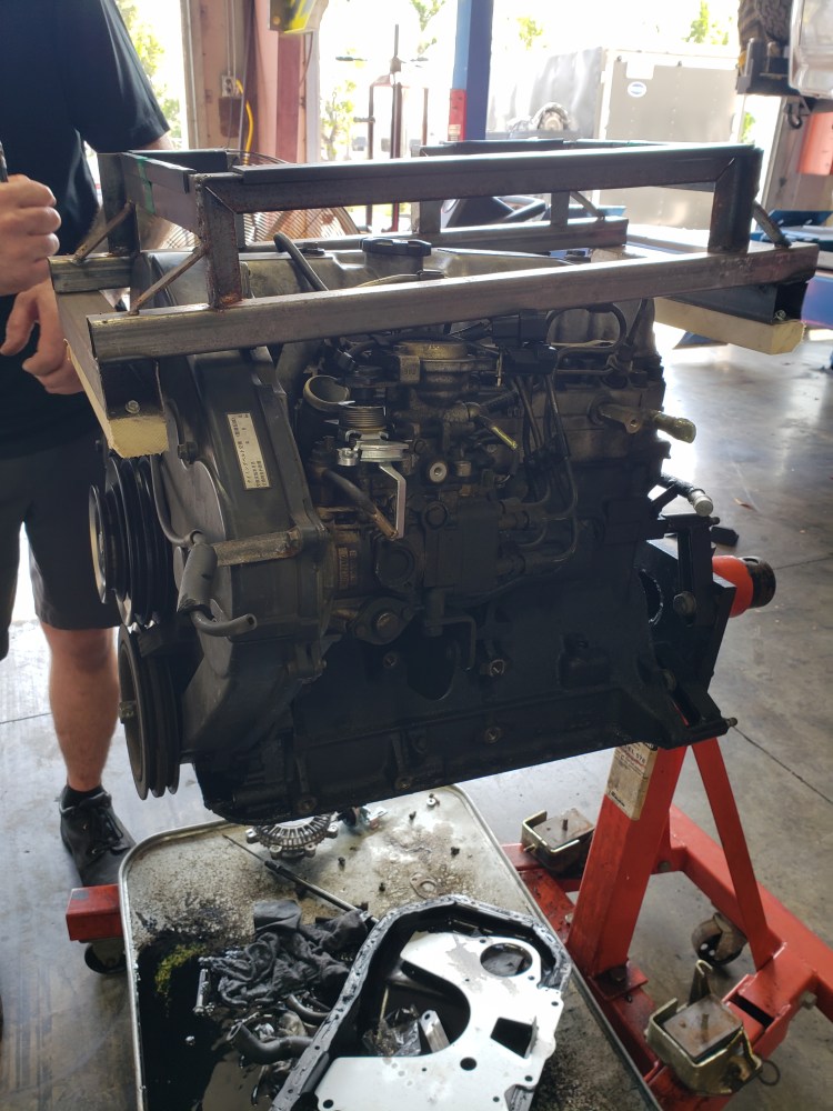 old engine outside of van