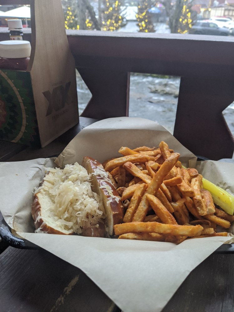 vegan brat with sauerkraut and fries