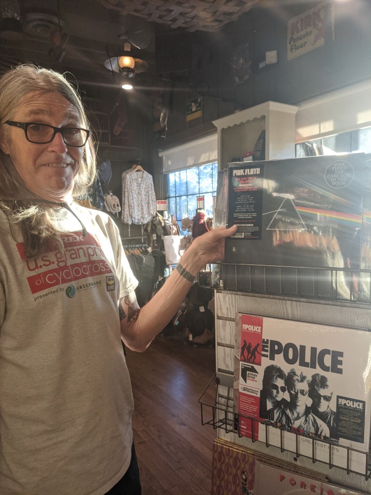 Mark holding a Pink Floyd LP in Cracker Barrel