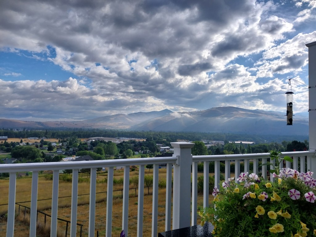 blue skies and clouds over a balcony