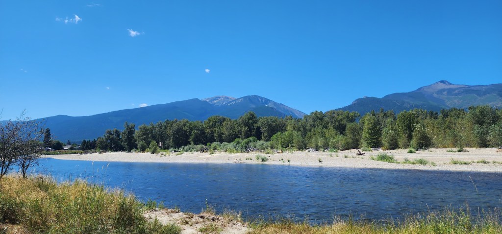 river in front of mountains