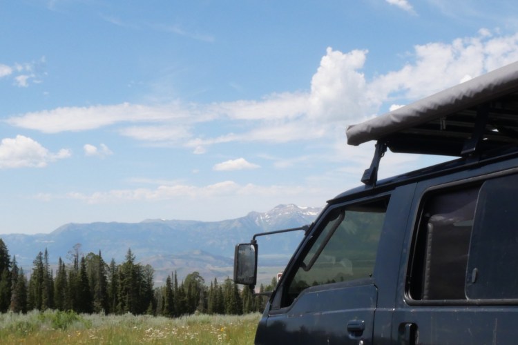 van with Teton range in background