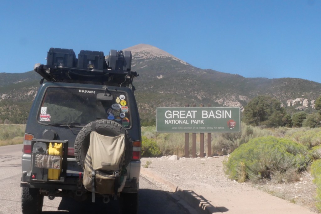van in front of Great Basin National Park sign