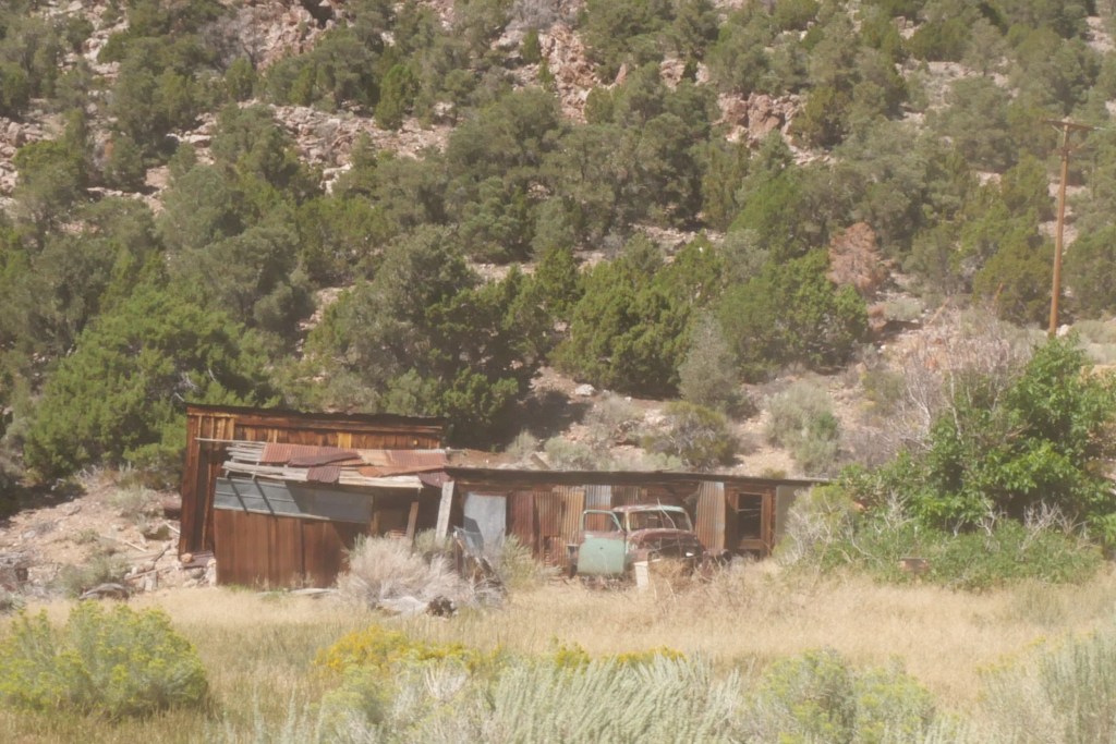 old shack and old truck on hillside